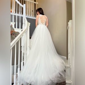 White ballgown wedding dress with lace sheer top and tulle skirt.